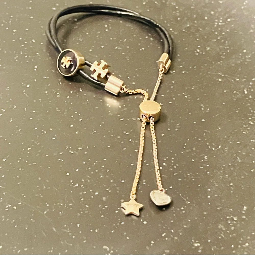 Tory Burch-Kira Double Leather Slider Bracelet in Black and Gold. Shows min wear
